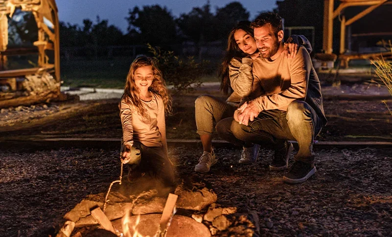 family around a campfire