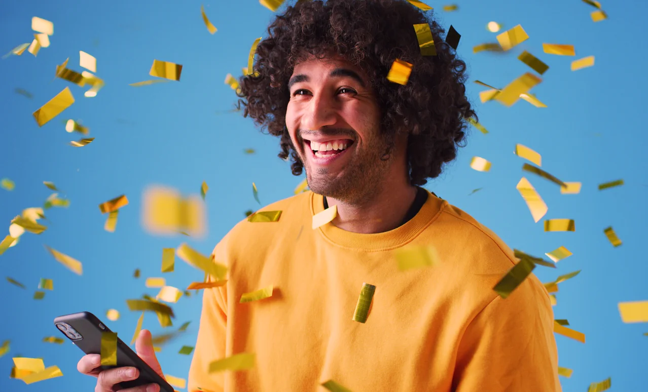 man surrounded by confetti