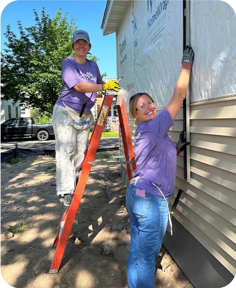 volunteers building a house